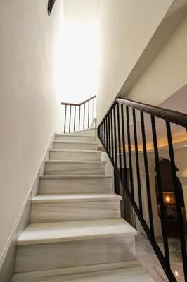 a staircase in a house with a stair case at Casa de lujo en Las Redes in El Puerto de Santa María