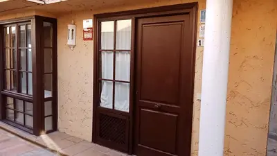 a pair of doors on the side of a building at Apartamentos Jasmund - Bungalow 117 in San Fernando