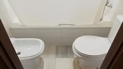 a bathroom with a toilet and a sink at Apartamentos Jasmund - Bungalow 117 in San Fernando