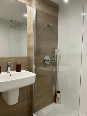 a bathroom with a shower and a sink and a shower at Apartamento en Costa Ballena in Chipiona