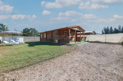 a tiny house on the side of a field at Bungalow Luna in Chiclana de la Frontera