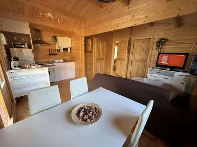 a kitchen with a white table with a bowl on it at Bungalow Luna in Chiclana de la Frontera