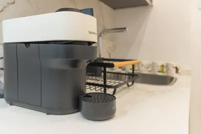 a coffee maker on a counter in a kitchen at Urania Cadiz Apartments by Soho Boutique in Cádiz