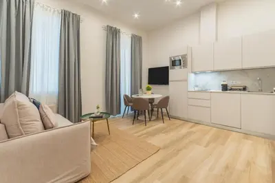 a living room with a couch and a table at Urania Cadiz Apartments by Soho Boutique in Cádiz