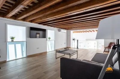 a living room with a couch and a table at Casa Amanecer by Cádiz Time in Cádiz