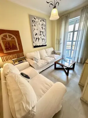 a living room with a couch and a table at GATU el Capitán 