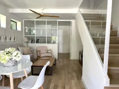 a living room with a couch and a table at La Buganvilla in Chiclana de la Frontera