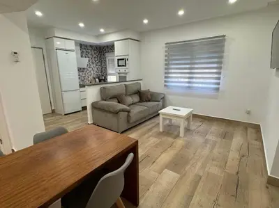 a living room with a couch and a table at El Refugio de Susana Grupo AC Gestion in Cádiz