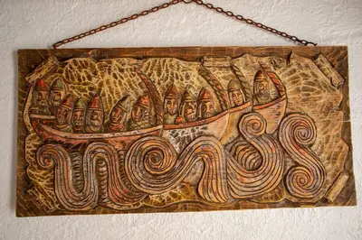 a painting of a boat hanging on a wall at Villa Tailan con piscina y jacuzzi privado in Chiclana de la Frontera