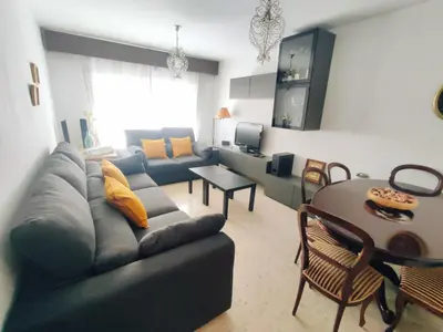 a living room with a couch and a table at Casa Comodoro in Cádiz