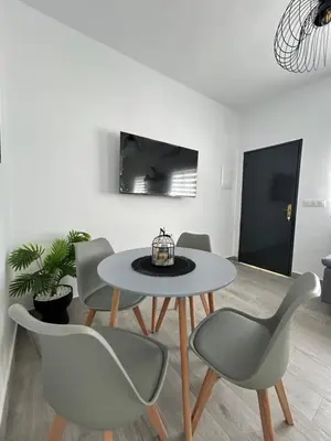 a dining room with a table and chairs at Capillita de Bajo Guía in Sanlúcar de Barrameda