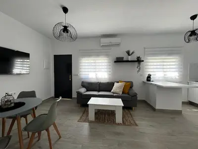a living room with a couch and a table at Capillita de Bajo Guía in Sanlúcar de Barrameda