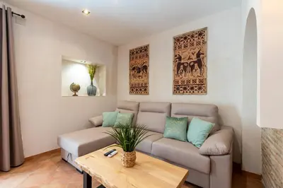 a living room with a couch and a table at Apartamento Isaac Peral 2 in Chipiona