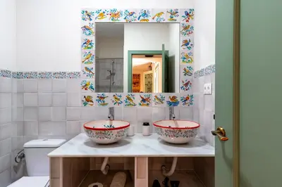 a bathroom with two sinks and a mirror at Apartamento Isaac Peral 2 in Chipiona