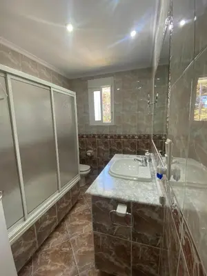a bathroom with a sink and a shower at Casitasmanoli Fuente del Gallo in Conil de la Frontera
