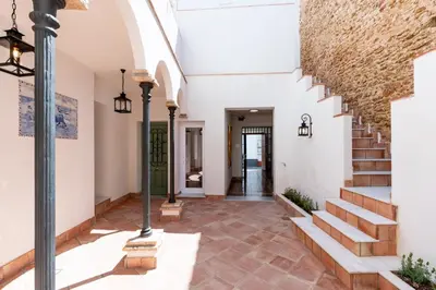a hallway of a house with stairs and a stair case at Apartamento Isaac Peral 1 in Chipiona