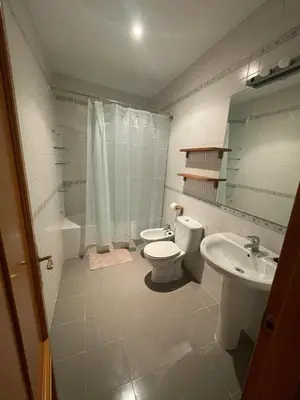 a bathroom with a toilet and a sink at Apartamento Céntrico in El Puerto de Santa María