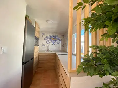 a kitchen with a refrigerator and a sink at Apartamento Isaac Peral 3 in Chipiona