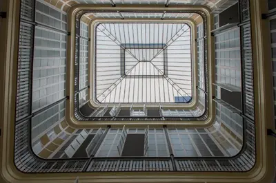 a view from the bottom of a building with a glass ceiling at Montera Suite Cádiz in Cádiz