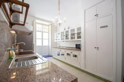 a kitchen with a sink and a counter top at Montera Suite Cádiz in Cádiz