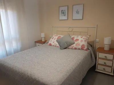 a bedroom with a bed with two pillows on it at Vistahermosa-El ancla in El Puerto de Santa María