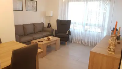 a living room with a couch and a table at Vistahermosa-El ancla in El Puerto de Santa María