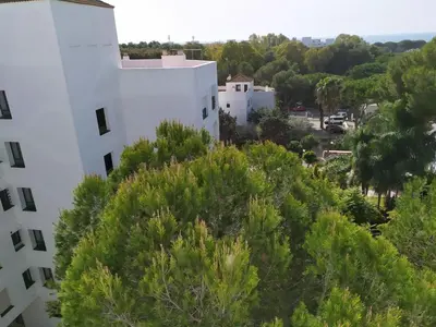 an aerial view of a white building with trees at Vistahermosa-El ancla in El Puerto de Santa María
