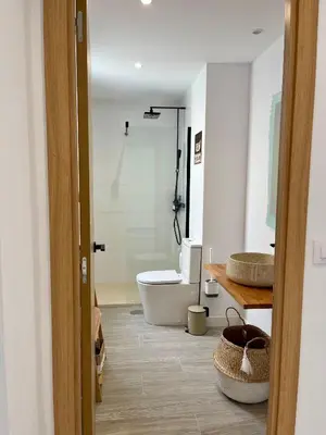a bathroom with a white toilet and a sink at Lindo Pisito Sanlucar Calle Ancha in Sanlúcar de Barrameda