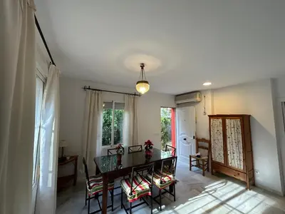a dining room with a table and chairs at Villa Rocio in El Puerto de Santa María