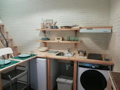 a living room with a tv and a table at Vicario 11 Estudio in El Puerto de Santa María
