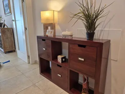 a wooden dresser with a sink in a room at GATU Ático Divino 