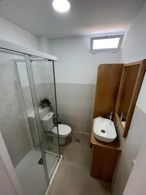 a bathroom with a shower and a toilet and a sink at Apartamento Chiclana de la frontera in Chiclana de la Frontera