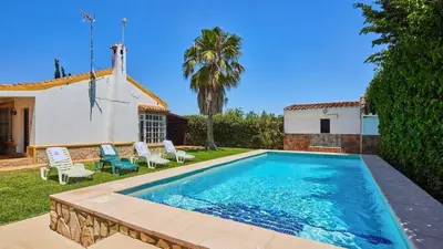 a swimming pool in the backyard of a house at Villa Alegría Conil de la Frontera by Ruralidays in Conil de la Frontera