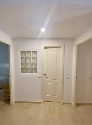 a room with a white door and a white wall at Novo Sancti Petri LUZ DEL NOVO in Novo Sancti Petri