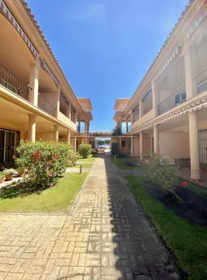 a cobblestone street in front of a building at Novo Sancti Petri LUZ DEL NOVO in Novo Sancti Petri