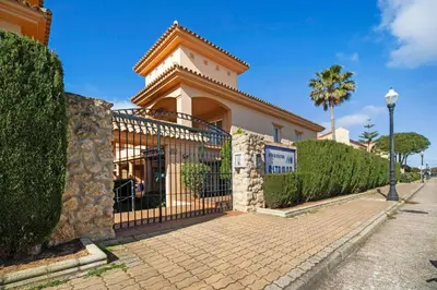 a house with a gate in front of it at Novo Sancti Petri LUZ DEL NOVO in Novo Sancti Petri