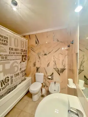 a bathroom with a toilet and a shower and a sink at Amplio adosado a pocos metros de la playa in Poblado de Sancti Petri