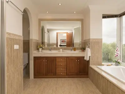 a bathroom with a tub and a large mirror at Holiday Home Arcos Gardens Golf by Interhome in Arcos de la Frontera