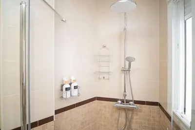 a bathroom with a shower with a glass door at Apartamento Rosole in Sanlúcar de Barrameda