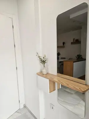 a mirror on a wall in a room at Casa en La Barrosa vista mar in Chiclana de la Frontera