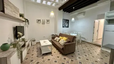 a living room with a couch and a table at Estudio de Mia in Cádiz