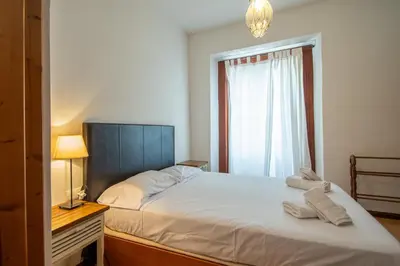 a bedroom with a bed and a window at Apartamento Santa M Serenity Cadiz in Cádiz
