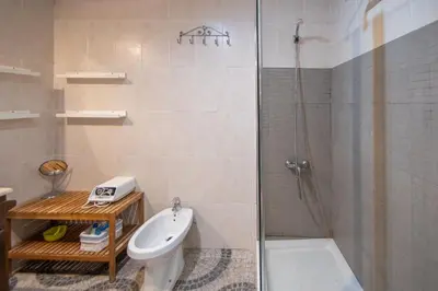 a bathroom with a shower and a toilet and a sink at Apartamento Santa M Serenity Cadiz in Cádiz