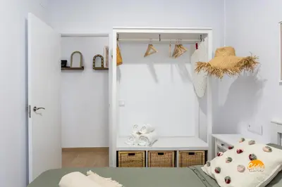 a small bedroom with a bed and a window at Brisa de Verano by Cadiz Time in Cádiz