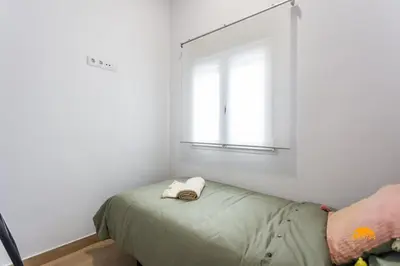a bedroom with a bed and a window at Brisa de Verano by Cadiz Time in Cádiz