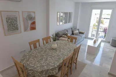 a dining room with a table and chairs at GINVA - Apartamento en pleno centro 3 in El Puerto de Santa María