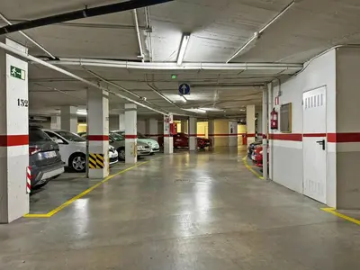 an empty parking garage with cars parked in it at Apartamento Minotauro - Ole Solutions in Jerez de la Frontera