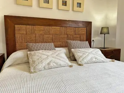 a bedroom with a large white bed with two pillows at Apartamento Minotauro - Ole Solutions in Jerez de la Frontera