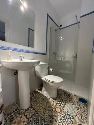 a bathroom with a sink and a toilet and a shower at Quilla Puerto Sherry in El Puerto de Santa María