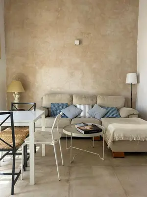 a living room with a couch and a table at Casa del Reloj - Puerto De Sta María in El Puerto de Santa María